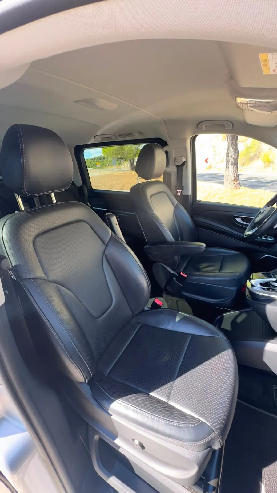 Black leather front seats inside the Mercedes V-Class van